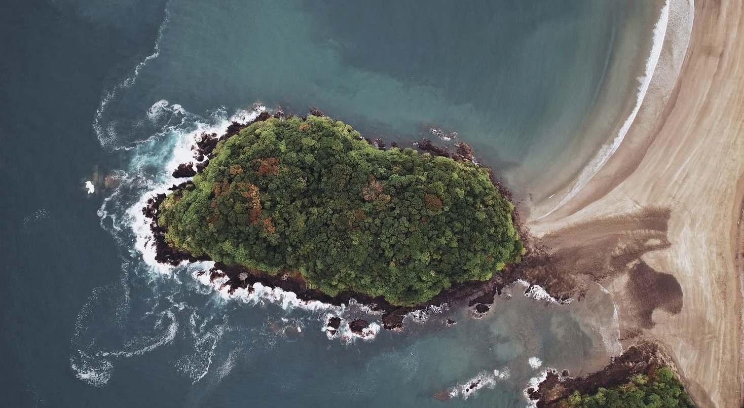 Aerial view of Playa Venao coastline and green island
